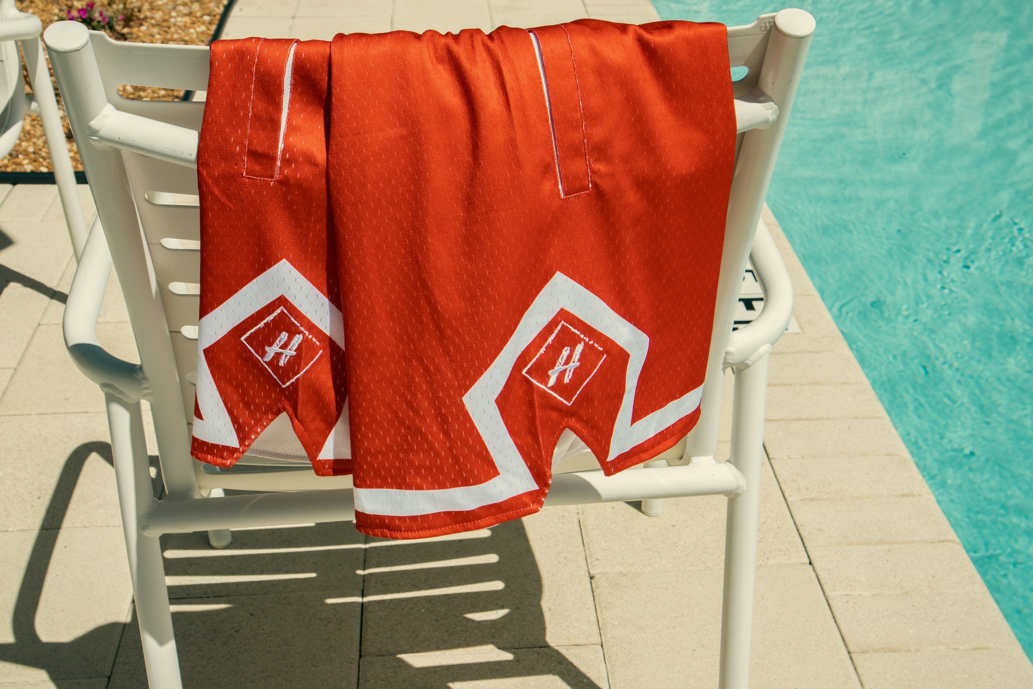 Light mesh shorts  Welt hand pockets  Graphics screened on both legs  Neatly stitched and printed design  inside drawstring