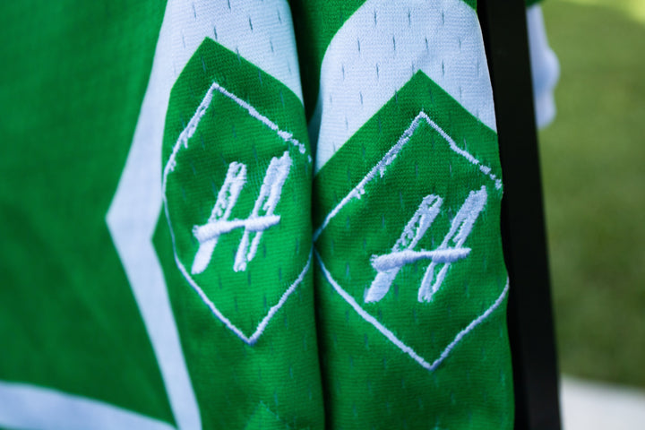Money Green Board Member Shorts is now available at our store with an inside draw string and light mesh. It features a snow-white line surrounding the bottom of the shorts with our signature H logo stitched on encapsulated by a neat pure white diamond. 