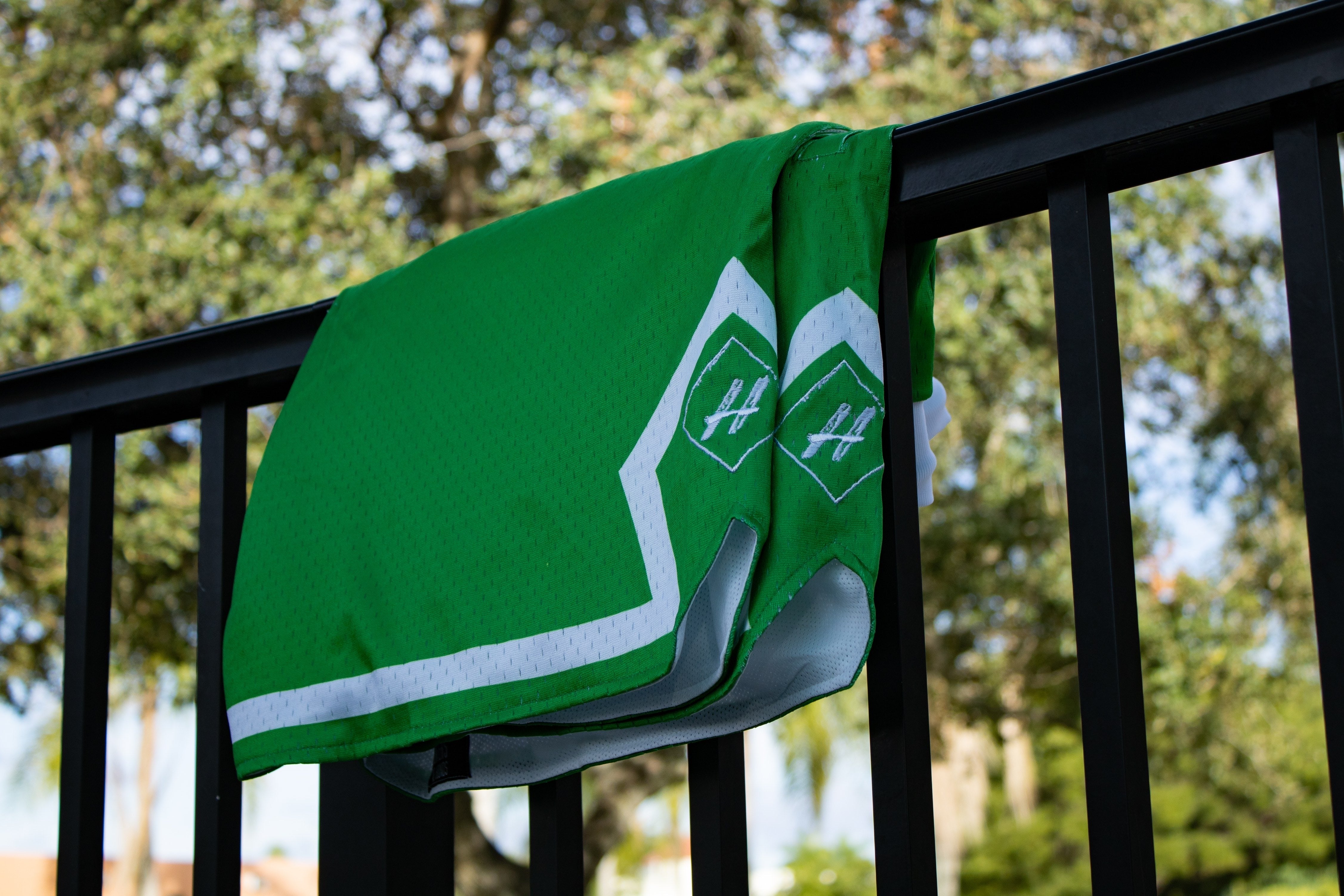 Money Green Board Member Shorts is now available at our store with an inside draw string and light mesh. It features a snow-white line surrounding the bottom of the shorts with our signature H logo stitched on encapsulated by a neat pure white diamond. 