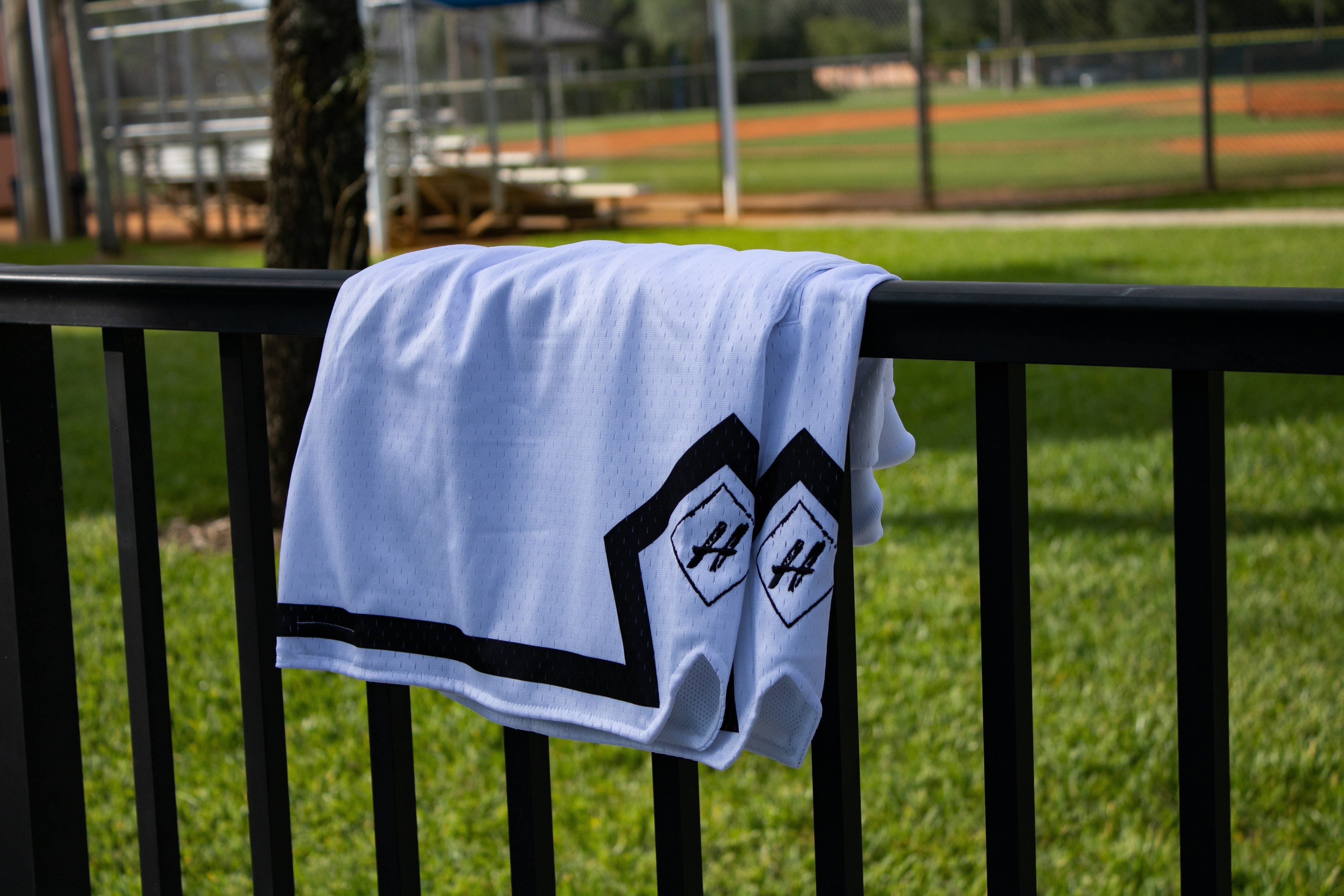 Pure White Board Member Shorts is now available at our store with an inside draw string and light mesh. It features a pitch black line surrounding the bottom of the shorts with our signature H logo stitched on encapsulated by a neat sable diamond. 